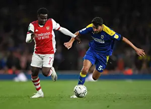 Arsenal V AFC Wimbledon 2021-22 Prints: Saka vs. Nightingale: Arsenal's Star Forward Meets Wimbledon's Defender in Carabao Cup Battle