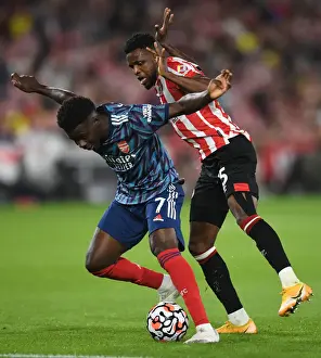 Brentford V Arsenal 2021-22 Prints: Saka vs. Onyeka: A Premier League Showdown - Arsenal vs. Brentford
