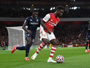 Arsenal v Aston Villa 2021-22 Collection: Saka vs. Tuanzebe: A Premier League Battle at Emirates Stadium