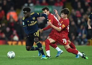 Images Dated 31st October 2019: Saka vs Williams: Intense Battle in Liverpool v Arsenal Carabao Cup Clash