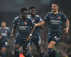 Saka and Xhaka Celebrate Arsenal's Third Goal Against Norwich City (Premier League 2021-22)