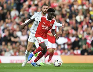 Saka's Skillful Dodge: Arsenal's Bukayo Saka Outmaneuvers Jordan Henderson in Premier League Clash