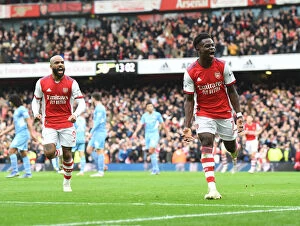 Images Dated 1st January 2022: Saka's Stunner: Arsenal's Triumph Over Manchester City