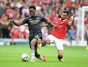 Manchester United V Arsenal 2022-23 Prints: Sambi of Arsenal Evades Bruno Fernandes: Manchester United vs Arsenal FC