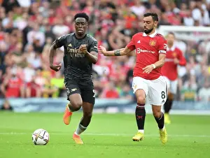 Manchester United V Arsenal 2022-23 Prints: Sambi of Arsenal Outmaneuvers Bruno Fernandes in Manchester United vs