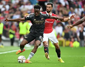 Manchester United V Arsenal 2022-23 Prints: Sambi Outmaneuvers Bruno Fernandes: A Premier League Battle at Old Trafford, 2022-23