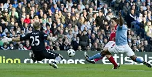 Manchester City v Arsenal 2010-11 Collection: Sami Nasri shoots past Man City goalkeeper Joe Hart to score the 1st Arsenal goal