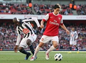 Images Dated 25th September 2010: Samir Narsi (Arsenal) beats Youssouf Mulumbu (WBA) to score Arsenals 1st goal