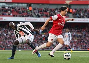 Arsenal v West Bromwich Albion 2010-11 Gallery: Samir Narsi (Arsenal) beats Youssouf Mulumbu (WBA) on his way to scoring Arsenals 1st goal