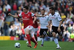 Images Dated 22nd May 2011: Samir Nasri (Arsenal) Aaron Hughes (Fulham). Fulham 2: 2 Arsenal, Barclays Premier League