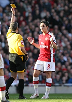 Samir Nasri (Arsenal) booked by referee Alan Wiley