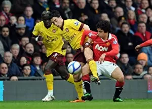 Images Dated 12th March 2011: Samir Nasri (Arsenal) Fabio da Silva (Man Utd). Manchester United 2: 0 Arsenal