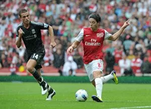 Arsenal v Liverpool 2011-2012 Collection: Samir Nasri (Arsenal) Jordan Henderson (Liverpool). Arsenal 0: 2 Liverpool
