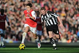 Arsenal v Newcastle United 2010-11 Collection: Samir Nasri (Arsenal) Kevin Nolan (Newcastle). Arsenal 0: 1 Newcastle United