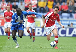 Images Dated 18th April 2010: Samir Nasri (Arsenal) Mohamed Diame (Wigan). Wigan Athletic 3: 2 Arsenal