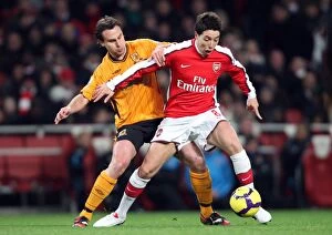 Images Dated 19th December 2009: Samir Nasri (Arsenal) Richard Garcia (Hull). Arsenal 3: 0 Hull City. Barclays Premier League