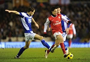 Images Dated 1st January 2011: Samir Nasri (Arsenal) Roger Johnson (Birmingham). Birmingham City 0: 3 Arsenal