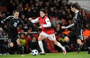 Arsenal v Partizan Belgrade 2010-11 Collection: Samir Nasri (Arsenal) Sasa Ilic (Partizan). Arsenal 3: 1 Partizan Belgrade