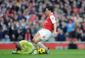 Images Dated 20th November 2010: Samir Nasri beats Heurelho Gomes (Tottenham) to the ball to score Arsenals 1st goal