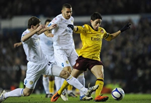 Leeds United v Arsenal FA Cup 2010-11 Collection: Samir Nasri breaks past Leeds defender Ben Parker to score the 1st Arsenal goal