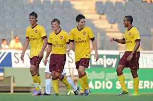 Samir Nasri celebrates scoring the 2nd Arsenal goal with Marouane Chamakh