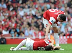 Arsenal v Blackburn Rovers 2010 - 2011 Collection: Samir Nasri injured on the floor as Robin van Persie (Arsenal) checks on him