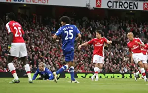 Samir Nasri shoots past Everton goalkeeper Tim Howard