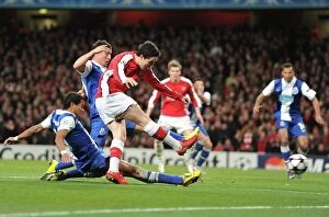 Arsenal v FC Porto 2009-10 Collection: Samir Nasri shoots past Porto goalkeeper Helton to score the 3rd Arsenal goal