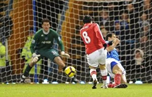 Portsmouth v Arsenal 2009-10 Collection: Samir Nasri shoots past Portsmouth goalkeeper Asmir Begovic to score the 2nd Arsenal goal