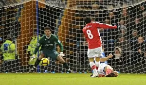 Portsmouth v Arsenal 2009-10 Collection: Samir Nasri shoots past Portsmouth goalkeeper Asmir Begovic to score the 2nd Arsenal goal