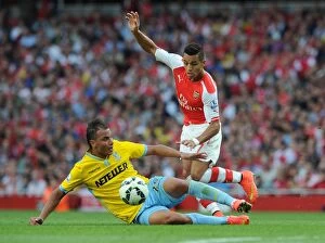 Images Dated 16th August 2014: Sanchez vs. Chamakh: A Battle of Arsenal Talents at Emirates Stadium