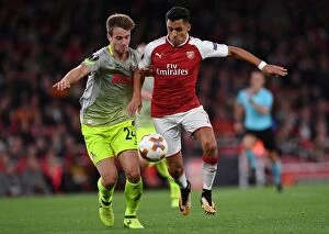 Arsenal v FC Köln 2017-18 Collection: Sanchez vs. Klunter: A Star-Studded Clash in Arsenal's Europa League Battle
