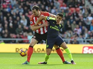 Sunderland v Arsenal 2016-17 Collection: Sanchez vs. O'Shea: Intense Battle in Sunderland v Arsenal (2016-17)
