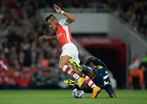 Arsenal V Southampton, League Cup 2014/15 Prints: Sanchez vs. Wanyama: A Footballing Battle at the Emirates - Arsenal vs