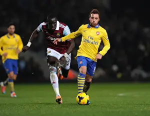 West Ham United V Arsenal 2013-14 Prints: Santi Cazorla Dashes Past Mohamed Diame: Arsenal vs