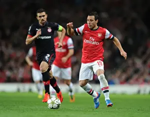 Arsenal V Olympiacos 2012-13 Prints: Santi Cazorla Outmaneuvers Giannis Maniatis: Arsenal FC vs Olympiacos FC