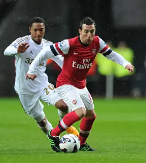 Swansea City V Arsenal 2012-13 Prints: Santi Cazorla Outmaneuvers Jonathan de Guzman: Swansea City vs Arsenal