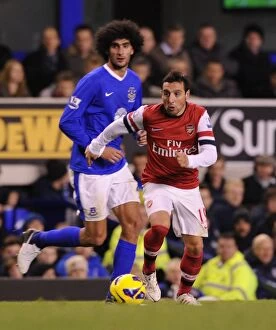 Images Dated 28th November 2012: Santi Cazorla Outmaneuvers Marouane Fellaini: Everton vs Arsenal, Premier League 2012-13
