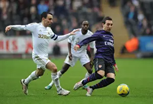 Swansea V Arsenal - FA Cup 3rd Rd 2012-13 Prints: Santi Cazorla Outsmarts Leon Britton: FA Cup Third Round Battle