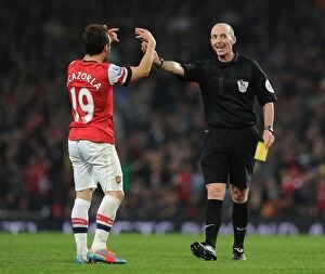 Manchester City Collection: Santi Cazorla and Referee Mike Dean Clash in Arsenal vs Manchester City Premier League Match
