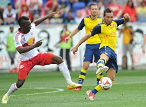 New York Red Bulls V Arsenal 2014-15 Prints: Santi Cazorla vs. Ambroise Oyongo: Arsenal vs. New York Red Bulls Pre-Season Clash