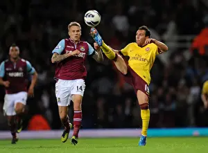 West Ham United V Arsenal 2012-13 Prints: Santi Cazorla vs Matt Taylor: Intense Battle in West Ham United vs Arsenal Premier League Clash