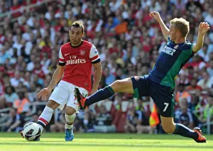 Arsenal V Sunderland 2012-13 Prints: Santi Cazorla vs Seb Larsson: Intense Battle for Ball Possession at Arsenal vs Sunderland (2012-13)