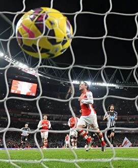Images Dated 12th December 2014: Santi Cazorla's Brace: Arsenal's Winning Moment Against Newcastle United (December 2014)
