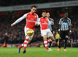 Arsenal v Newcastle United 2014/15 Collection: Santi Cazorla's Double from the Penalty Spot: Arsenal's Triumph over Newcastle United