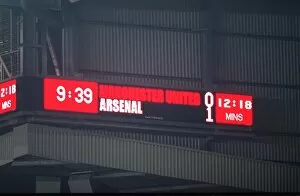 Man Utd v Arsenal Collection: The scoreboard at Old Trafford shows the final score