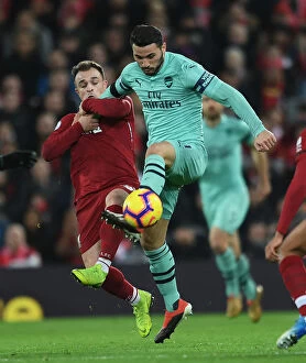 Images Dated 29th December 2018: Sead Kolasinac vs Xherdan Shaqiri: Intense Battle at Anfield - Liverpool vs Arsenal