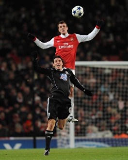 Arsenal v Partizan Belgrade 2010-11 Collection: Sebastien Squillaci (Arsenal) Cleo (Partizan). Arsenal 3: 1 Partizan Belgrade