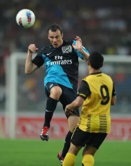 Images Dated 13th July 2011: Sebastien Squillaci (Arsenal) Norshahrul Talaha (Malaysia). Malaysia XI 0: 4 Arsenal