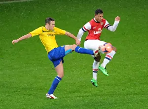 Serge Gnabry vs Blair Adams: Intense Battle at Arsenal's Emirates Stadium - FA Cup Fourth Round, 2014